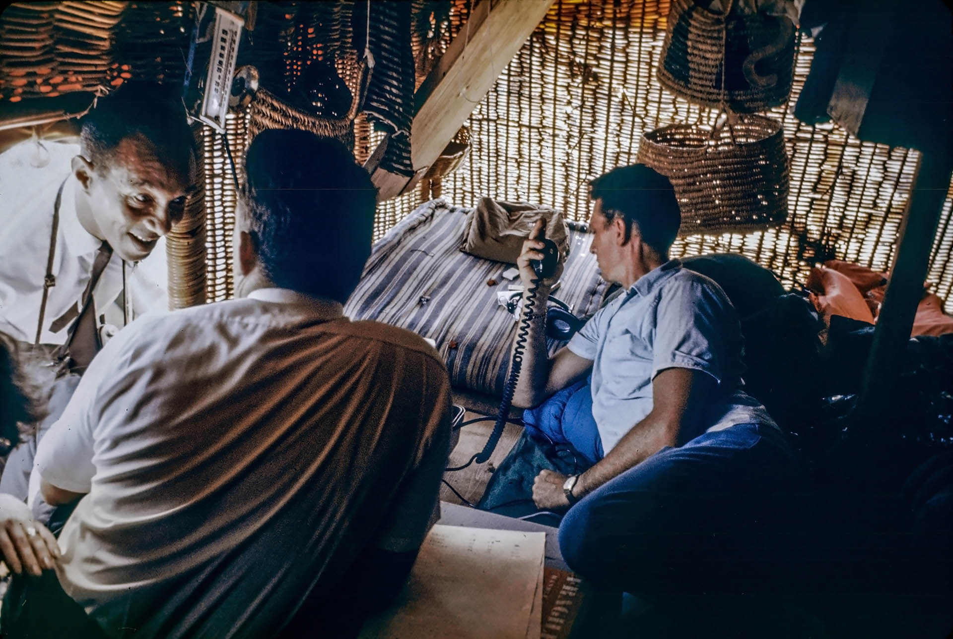 On board of Ra II a few days after arrival - photographer Paul Mandeville talks with Pat Toppin while Alan Otway mans the ham radio.