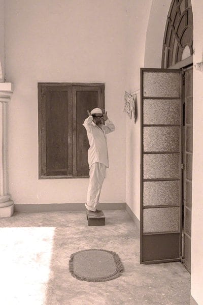 The muazzin recites the Adhan calling worshippers to Jumma Masjid 1976 h3-11-37